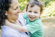 © Inti St Clair/Blend Images - Caucasian mother carrying smiling son