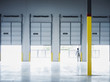 © Erik Isakson/Blend Images - Caucasian businessman lifting loading dock door