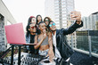 © Peathegee Inc/Blend Images - Friends taking selfie with DJ at party