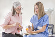 © Mike Kemp/Blend Images - Caucasian nurse explaining prescription to patient