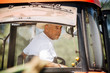 © Inti St Clair/Blend Images - Caucasian farmer driving tractor
