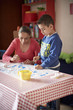 © Paco Navarro/Blend Images - Hispanic mother and son painting stars at table