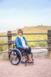 © PhotoAbility/Blend Images - Paraplegic woman in wheelchair in scenic landscape