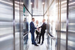 © 4frame group - Business team going on elevator and talking