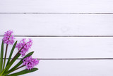 Fototapeta Lawenda - lilac flowers on wooden table background, top view