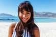 © Jacob Lund - Young woman at the beach and smiling