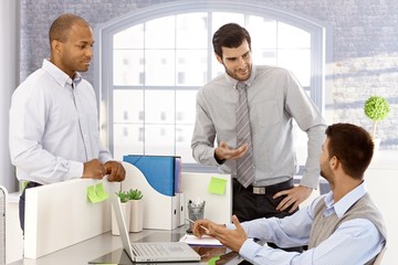 Canvas Print - Young businessmen working together