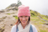 Fototapeta Sawanna - A woman in a winter cap in Eugene, OR
