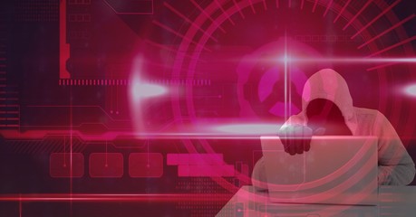 Wall Mural - digital composite image of hacker using laptop over pink screen