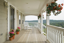 Large Front Porch Of Shingle Style Home With Great View Of Tree Tops