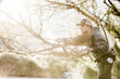 © Mike Kemp/Blend Images - Caucasian man fly fishing in river