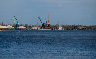 Cranes in cargo port on a river Dnieper in Kremenchug, Ukraine