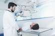 © REB Images/Blend Images - Hispanic doctor comforting patient at x-ray machine