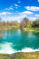       Beautiful landscape, waterfall, clear green water and on Mreznica river in Croatia, panoramic view. 