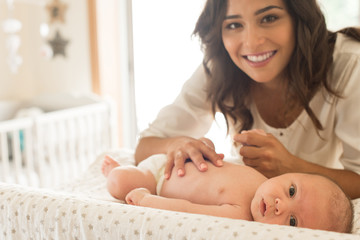 Wall Mural - mother moisturizing baby