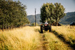 © Inti St Clair/Blend Images - Caucasian farmer riding tractor
