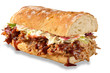 Pulled pork with barbecue sauce and coleslaw on a submarine French bread sandwich. Isolated with drop shadow below.