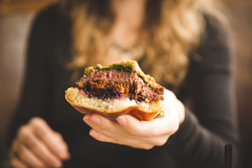 Woman Holding Hamburger