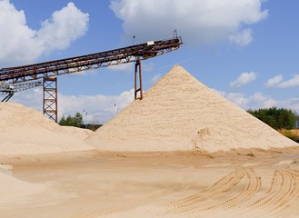 Conveyor belts and sand heaps. Construction industry. Sand quarry. Horizontal  photo