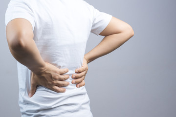 Woman putting her hands for back or spine pain