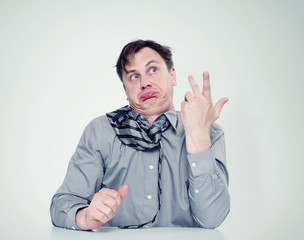 Strongly drunk man in shirt and tie