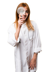 Wall Mural - Young doctor woman with magnifying glass