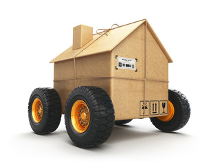 Cardboard house box with wheels isolated on white background. Moving, logistics and delivery concept.