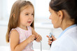 © rogerphoto - Happy little girl at  health exam at doctor office. Medicine and health care concept