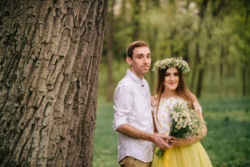 A loving couple hugging in a spring park