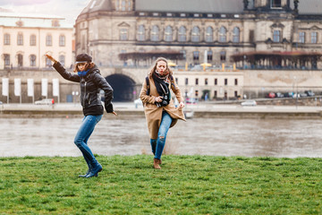 Wall Mural - Two beautiful young tourists having fun in old european town