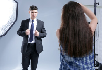 Wall Mural - Model posing for professional photographer at studio