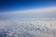 Blue sky and clouds - view from plane window