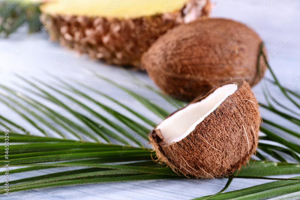 Coconut on wooden table, closeup