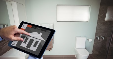 Sticker - Hand using smart home app on tablet PC in washroom