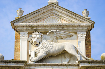 Lion of Saint Mark close-up on a pedestal at the Venetian Arsenal in Venice, Italy