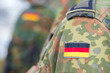 © filmbildfabrik - german flag on german army uniform