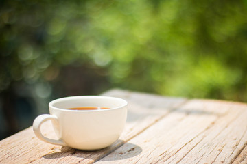 A cup of coffee on a wooden