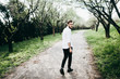 © shunevich - Handsome groom walking in the park