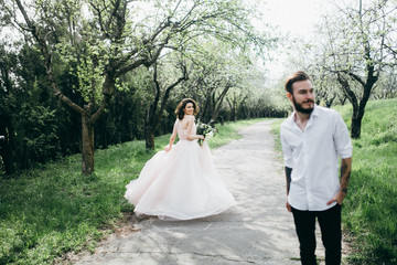 Wall Mural -  Loves and very happy groom and bride in the park