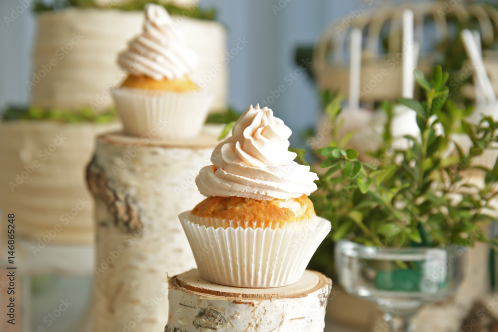 Tasty cupcake in candy bar with forest style decorations