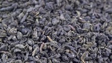 Chinese Gunpowder (pearl) Green Tea - Macro Turning Background