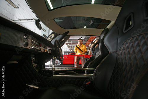 A Visitor Looks At The Interior Of A Spyker C8 Laviolette