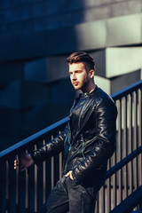 Wall Mural - Photo of handsome man in black leather jacket