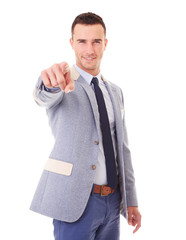 Wall Mural - Young smiling man pointing at you, on a white background