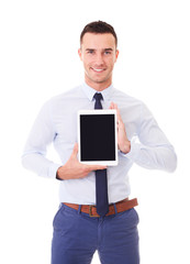 Wall Mural - Happy man in blue shirt with tablet computer. Isolated on white background