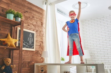 Wall Mural - child plays superhero