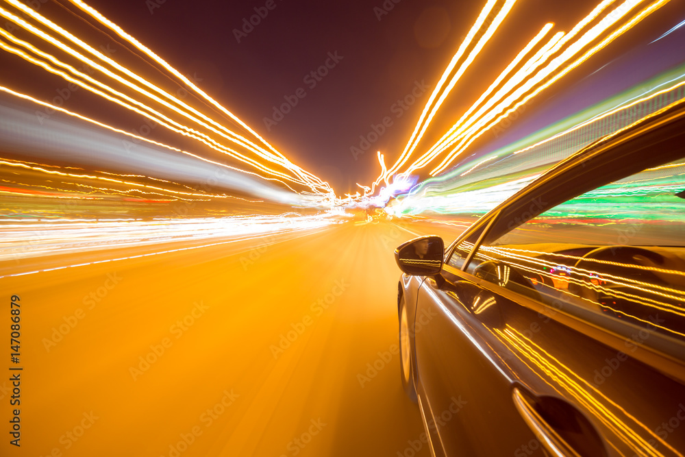 View from Side of Car moving in a night city, Blured road with lights ...