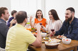 © Prostock-studio - Group of happy young people at dinner table, friends party