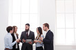 © Prostock-studio - Corporate meeting in office, business people with copy space