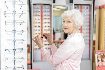 Curious old lady keeping eyewear